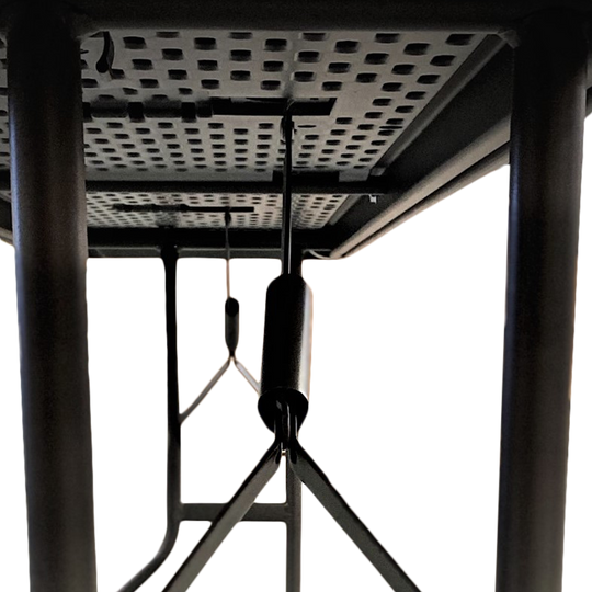 An underside view of a charcoal table.