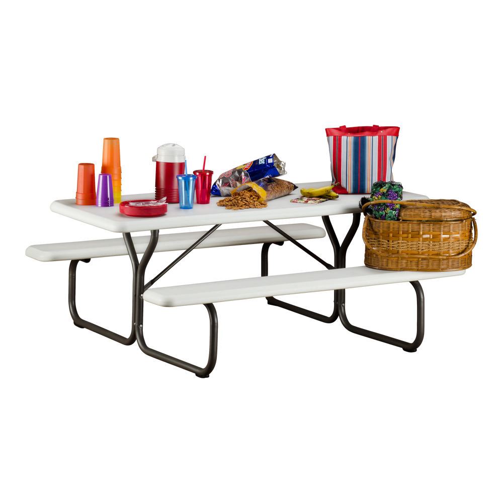 A platinum picnic table with picnic supplies on top.
