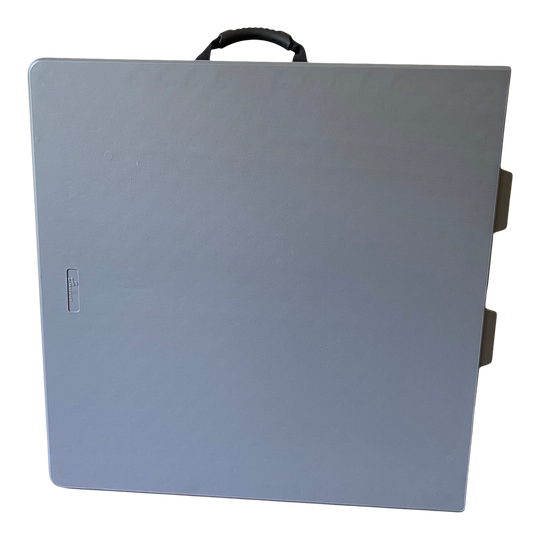 A closeup pictured of a folded charcoal bi-fold folding table.