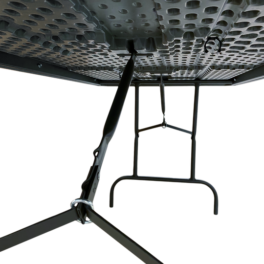 A picture of the underside view of a charcoal table.