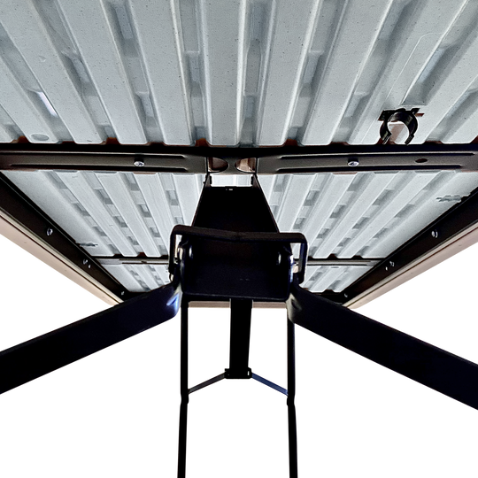 An underside picture of a platinum folding table.