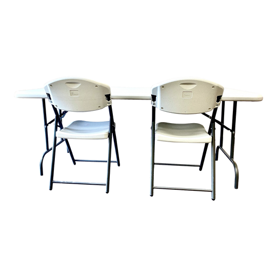 Platinum table with two platinum chairs in front of it.